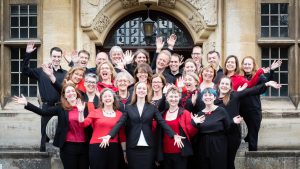 The Lea Singers do jazz hands on the steps of Academy St Albans in June 2019